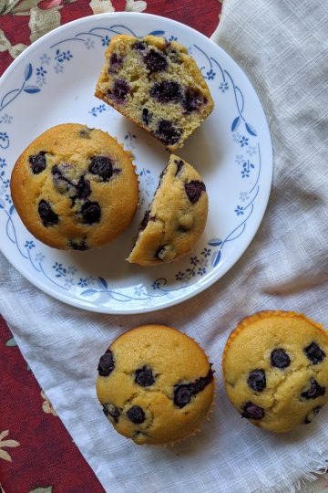 blueberry muffins out on a table