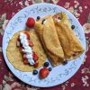 whole wheat crepes, served with berries and whipped cream