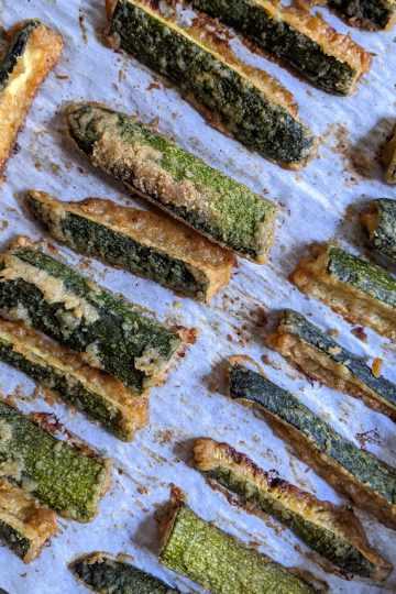 zucchini parmesan sticks on baking sheet