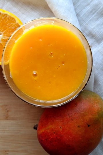 mango pineapple orange juice, seen from above