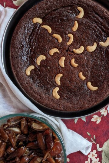 Date cake in a thali, with bowl of dates to the side