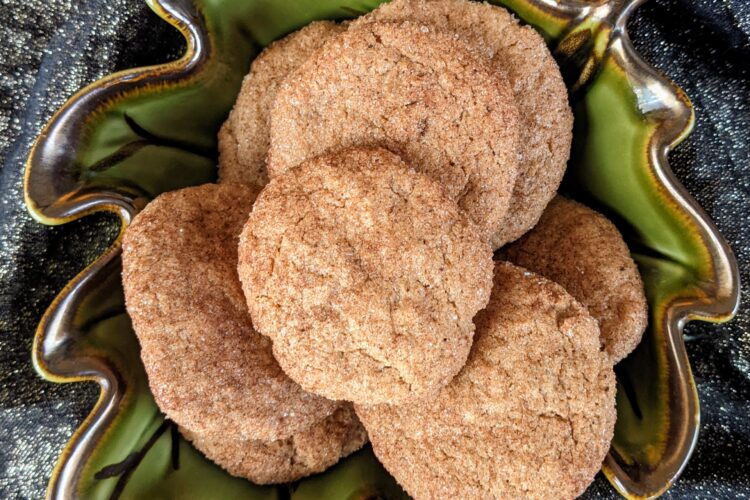 Pumpkin spice cookies in a green leaf bowl, top view