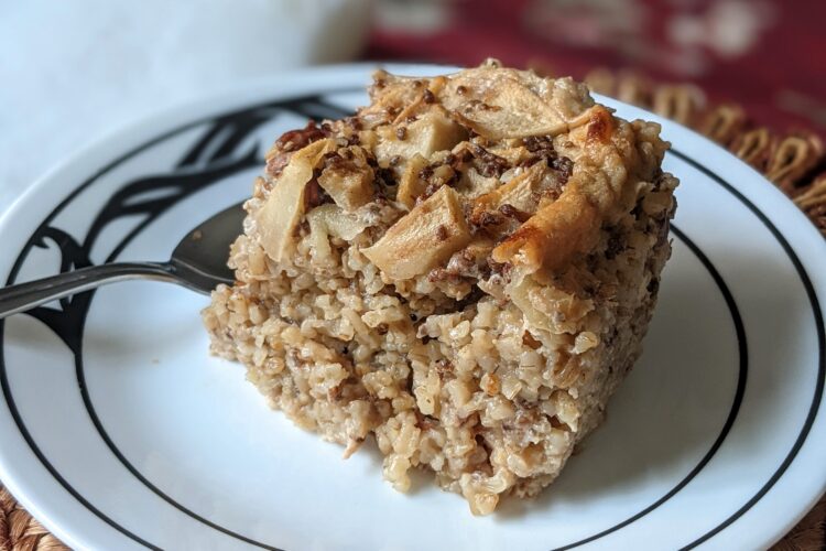 Baked Steel Cut Oats piece on plate with spoon