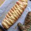 Rose danish braid on tray with oven mitt top view