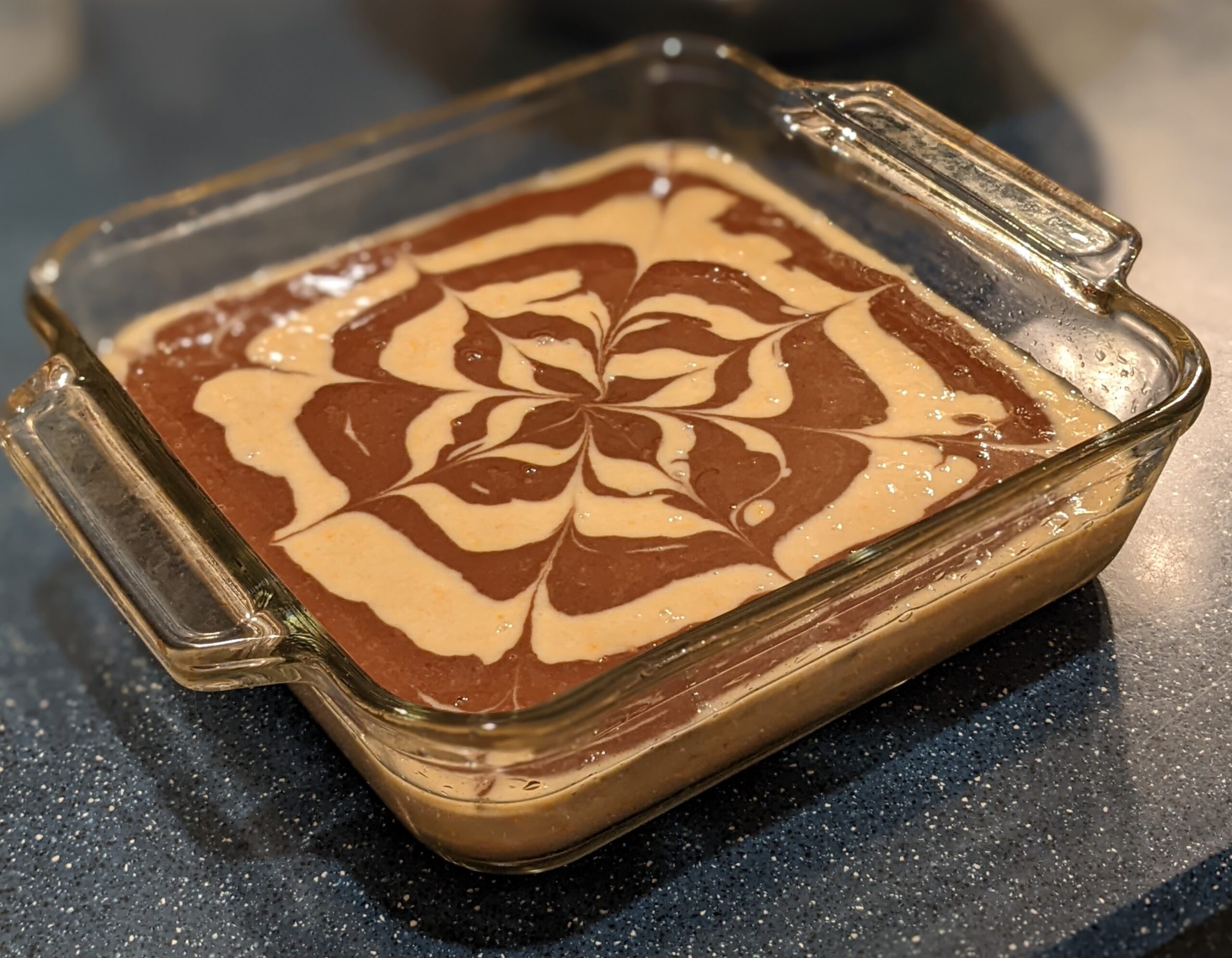 Chocolate orange zebra cake with swirled batter