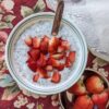 3-ingredient Chia Pudding top view with whole strawberries on side