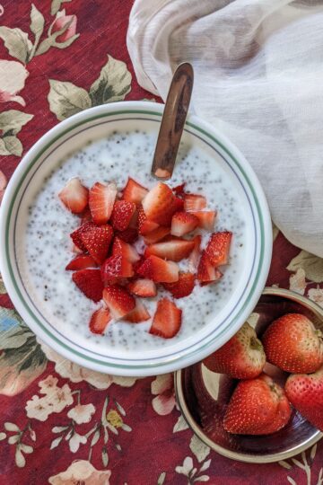 3-ingredient Chia Pudding top view with whole strawberries on side
