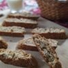 Banana Almond Biscotti with milk glass and basket in background